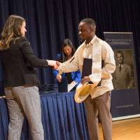 Emily shaking hands with Joseph